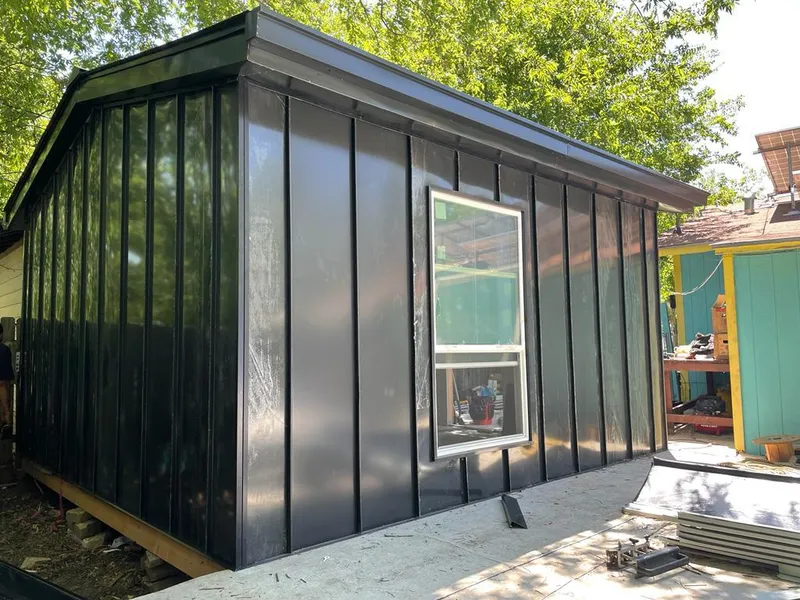 Black standing seam metal wall panels for Roof Inspection in New Castle